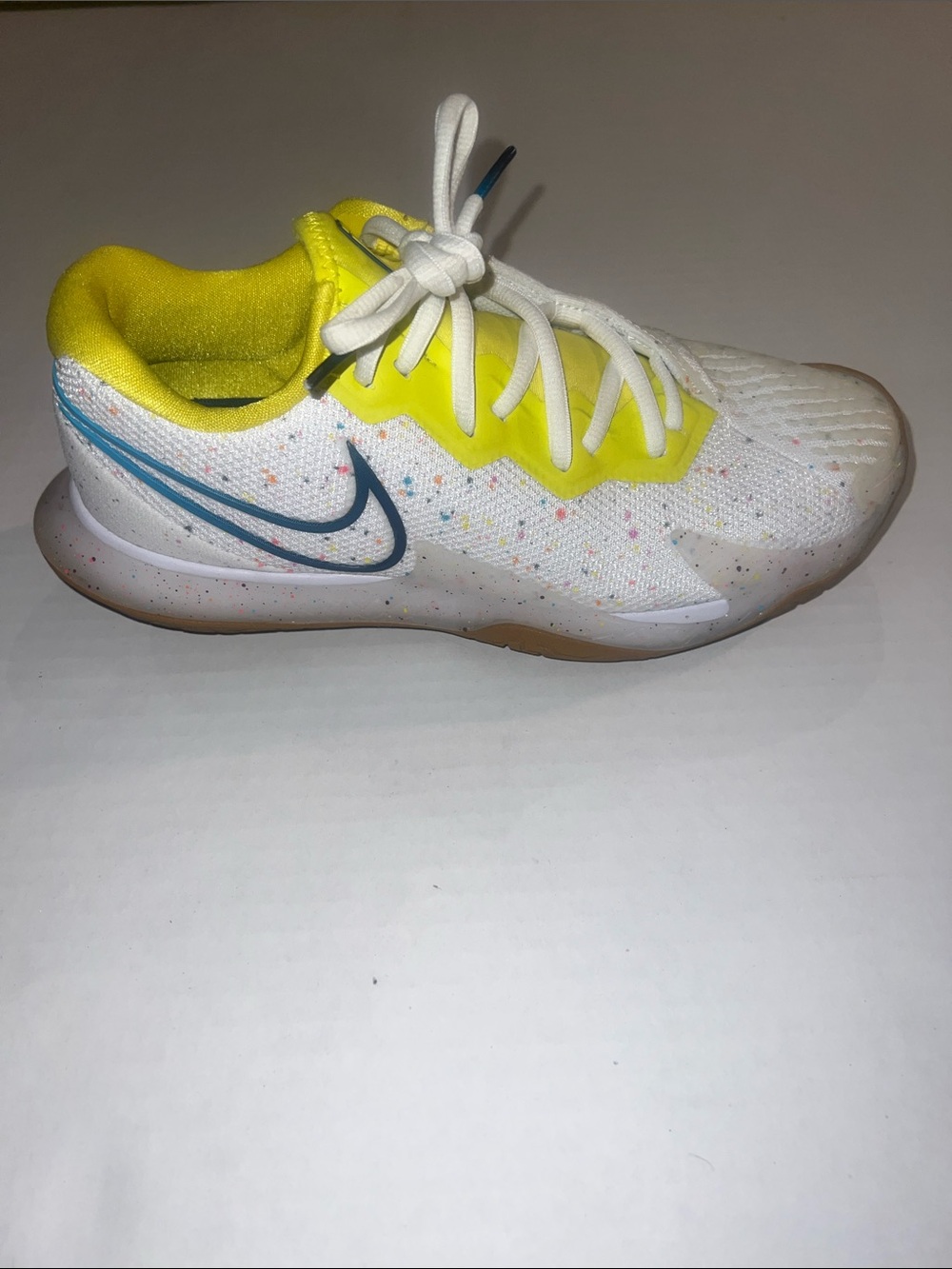 Nike Women’s Tennis Sneaker White with Yellow Lining and Teal Swoosh